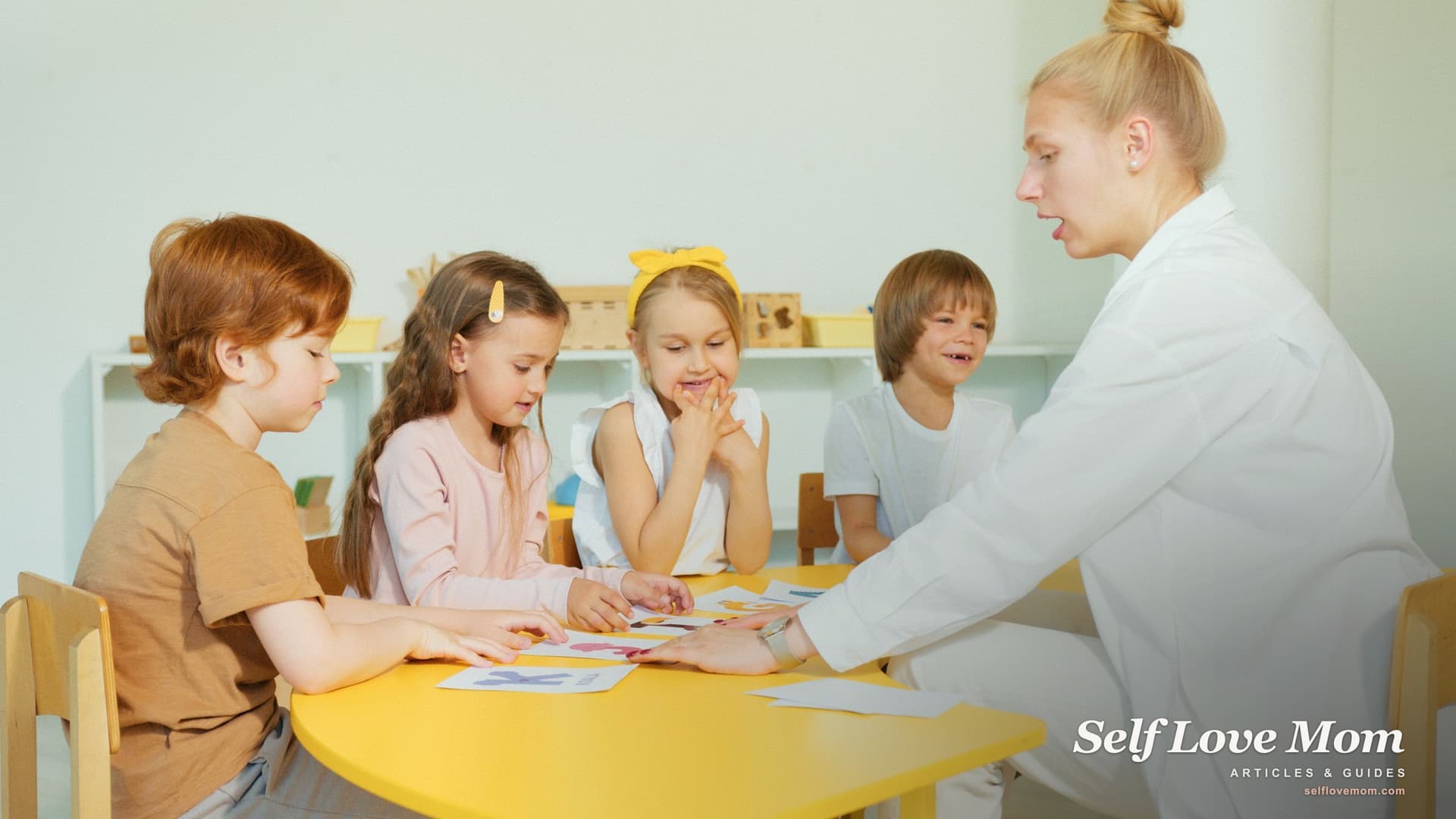 A caregiver works with young children at a bright daycare table, the kind of care childcare assistance helps single mothers afford.